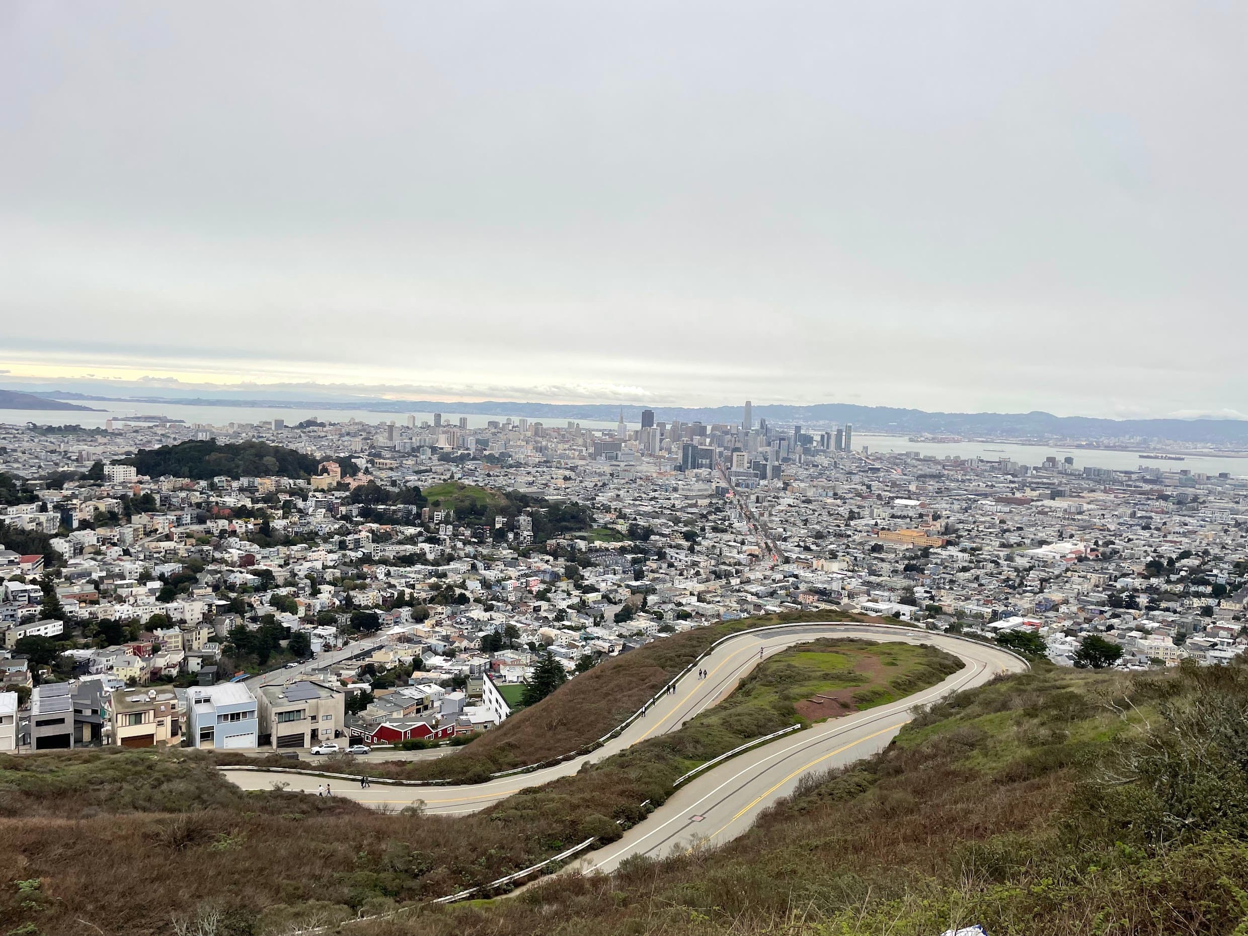 The view from Twin Peaks over San Francisco's rooftops toward the downtown skyline and the bay